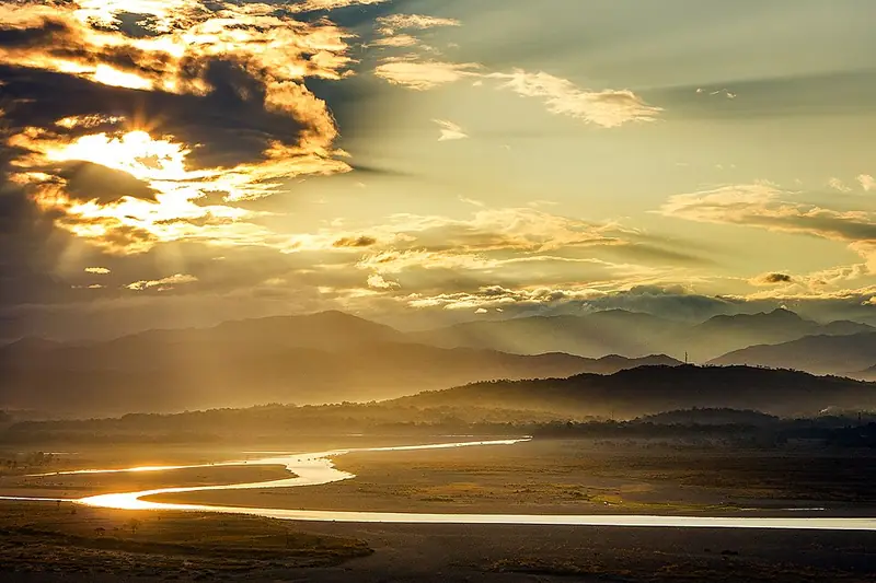 Morning light over a winding river in the Abra valley