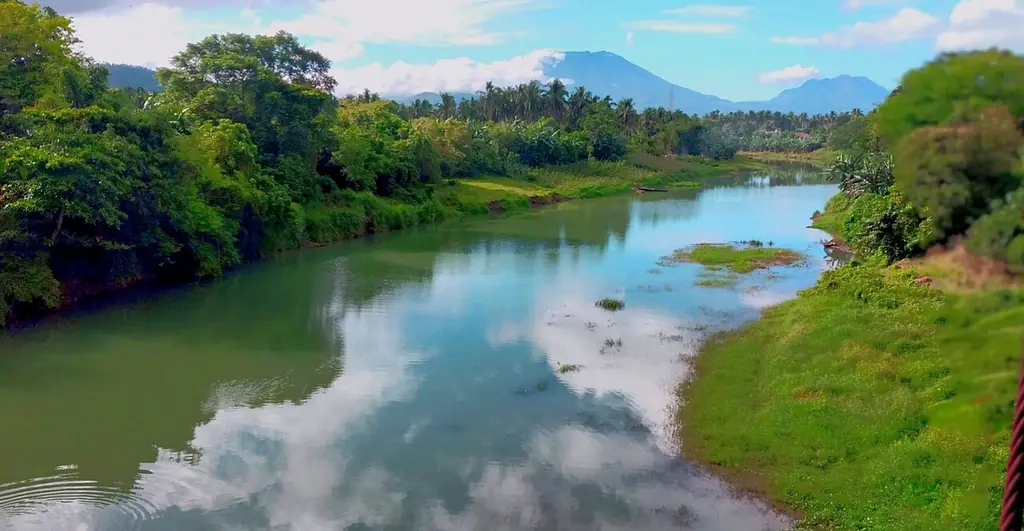 The Pagsanjan River winding between green banks