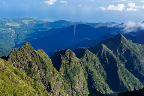 The jagged forested ridges of Mount Guiting-Guiting